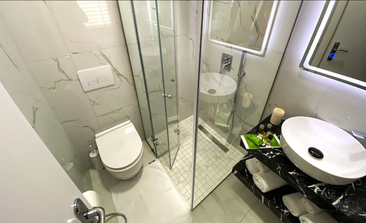 superior twin room | bathroom | free toiletries, hair dryer, bathrobes, slippers