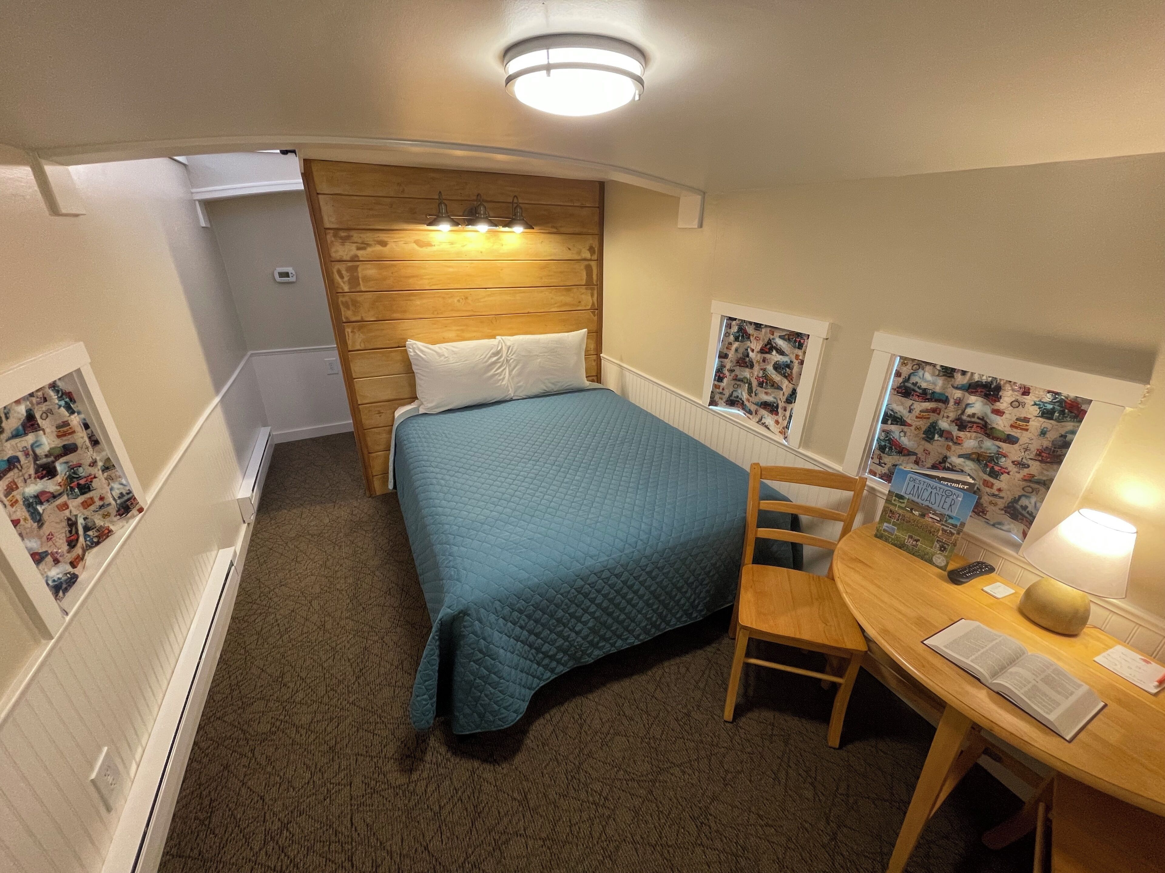 Medium Family Caboose, 1 Double Bed and 3 Single Bunks | Individually decorated, individually furnished, blackout drapes