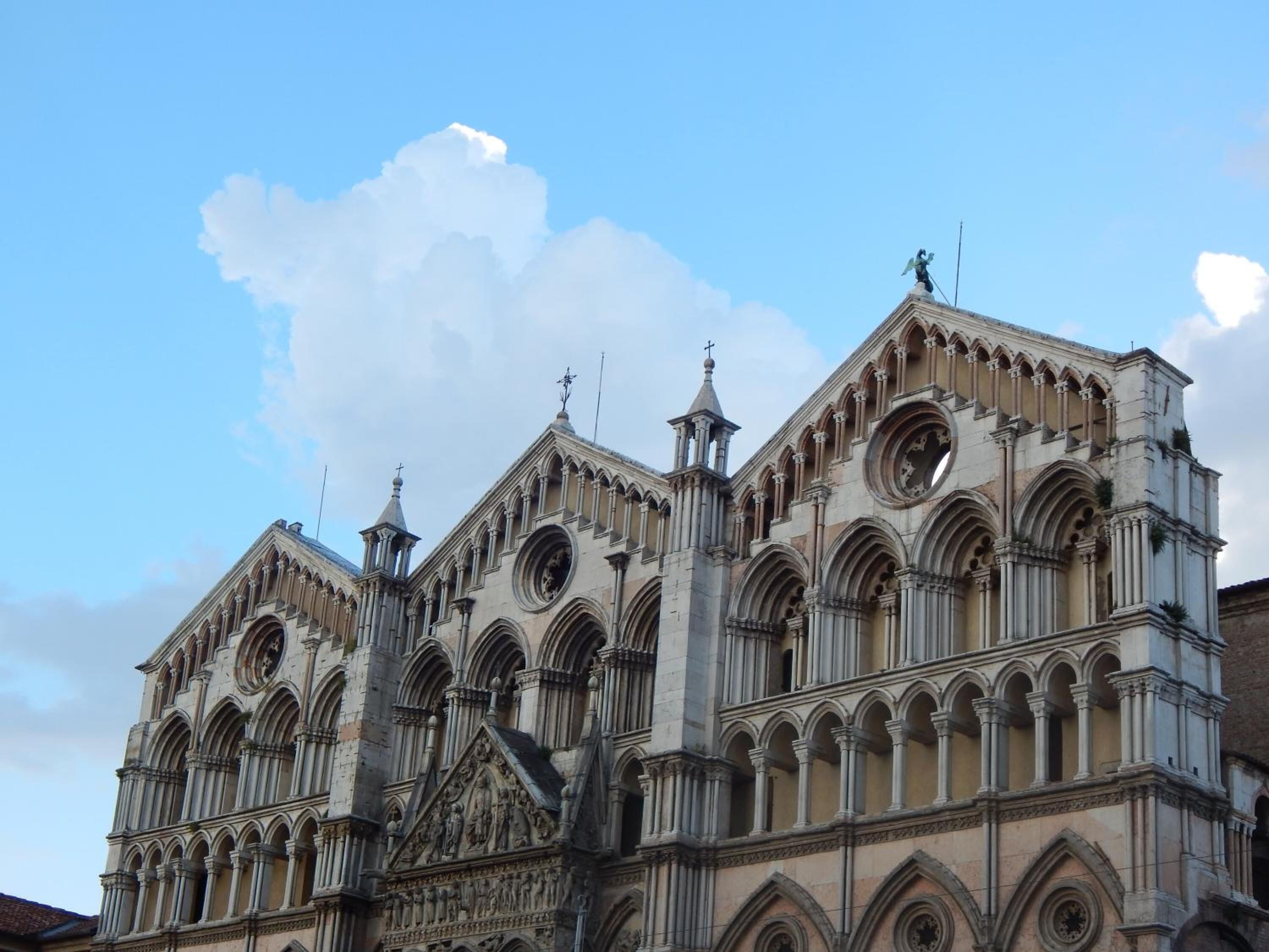 A historic building with Gothic architecture, featuring pointed arches and intricate stone carvings.
