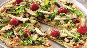 A pizza with various toppings.