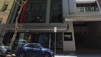 A modern building with a sign for 'mantra midtown'.