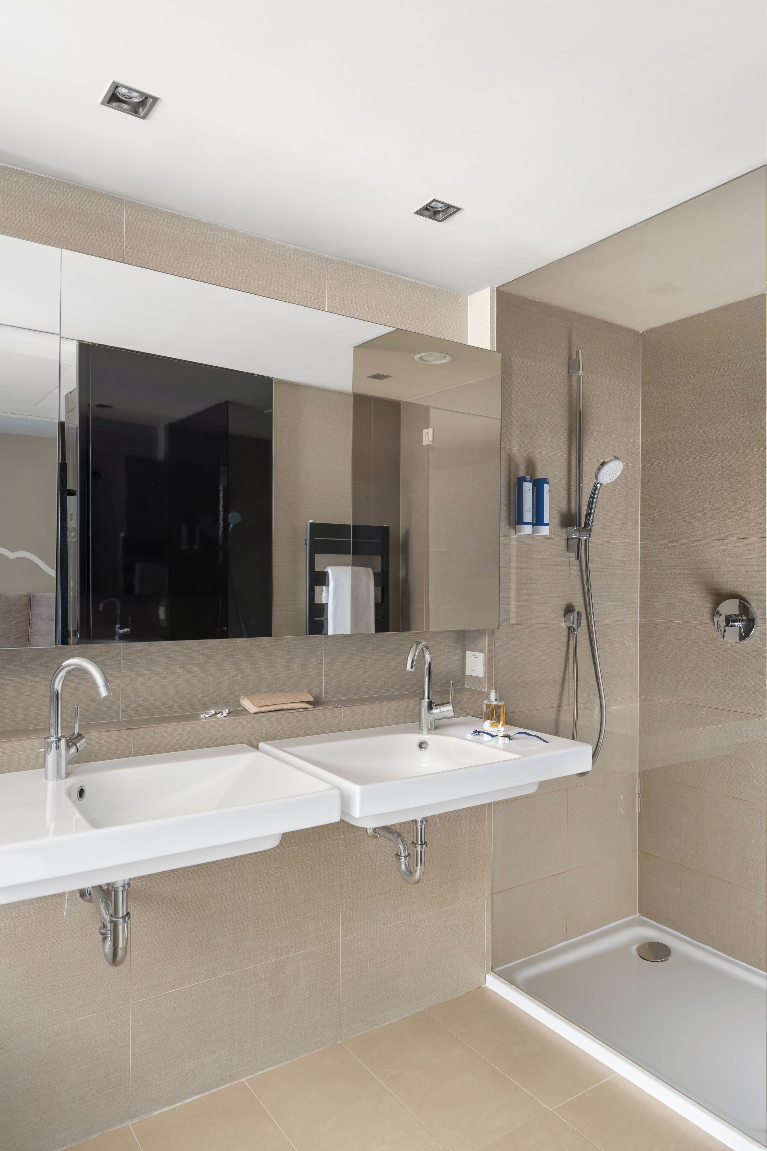 junior suite | bathroom | rainfall showerhead, free toiletries, hair dryer, towels