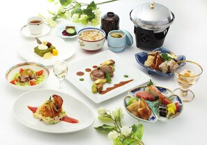 A variety of dishes and beverages arranged on a table, including a teapot, cups, and plates with food. - Hotel Awina Osaka (Osaka)