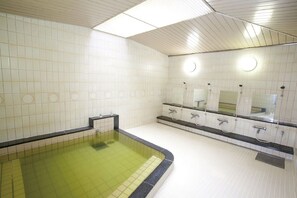 A public restroom with a pool, tiled walls, and multiple sinks. - Hotel Awina Osaka (Osaka)