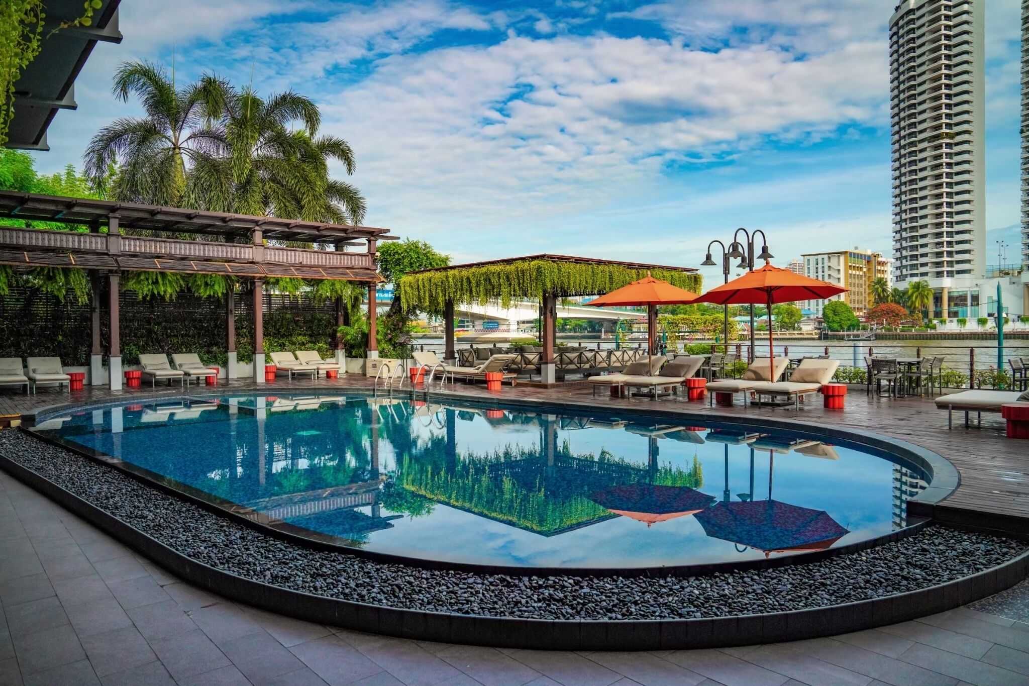 Outdoor pool, open 6:00 AM to 9:00 PM, pool umbrellas, pool loungers