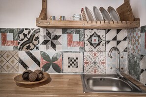 Fridge, toaster, cookware/dishes/utensils