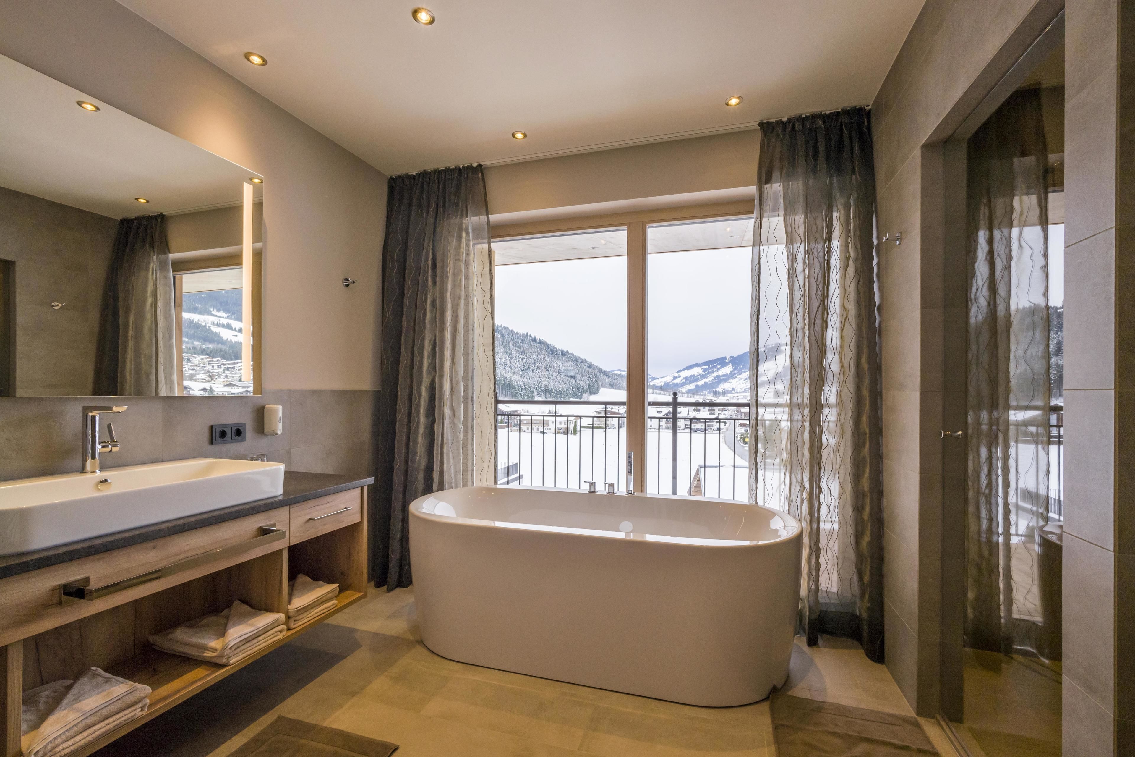 panoramic suite, 1 king bed with sofa bed, bathtub, mountain view | bathroom | shower, rainfall showerhead, free toiletries, hair dryer