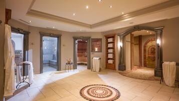 Relax in a spacious, elegantly designed area with comfortable seating and a beautiful book collection.