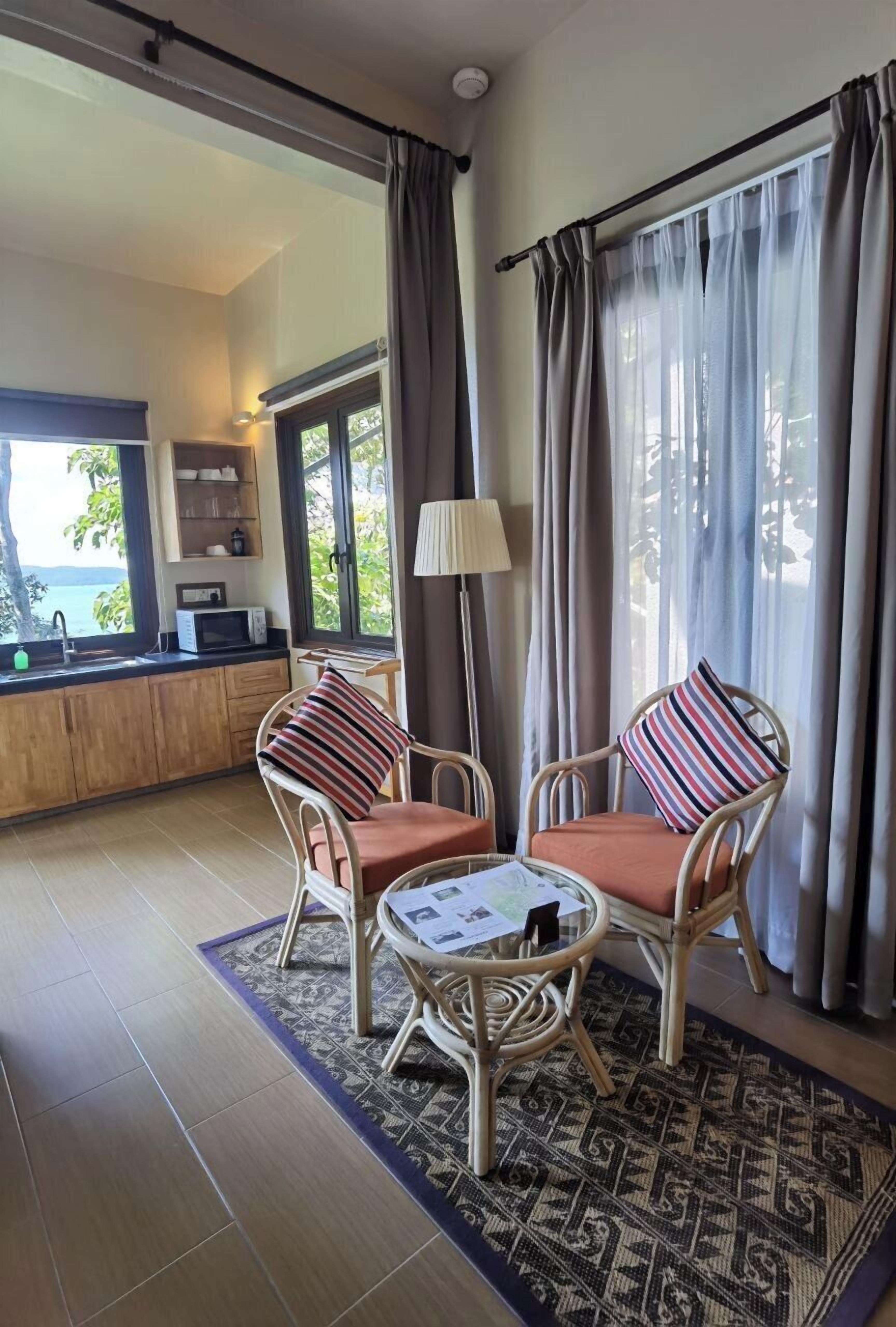 Canopy Studio | Living area | 32-inch flat-screen TV with satellite channels, TV, DVD player