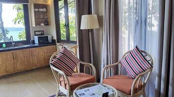 Canopy Studio | Living area | 32-inch flat-screen TV with satellite channels, TV, DVD player