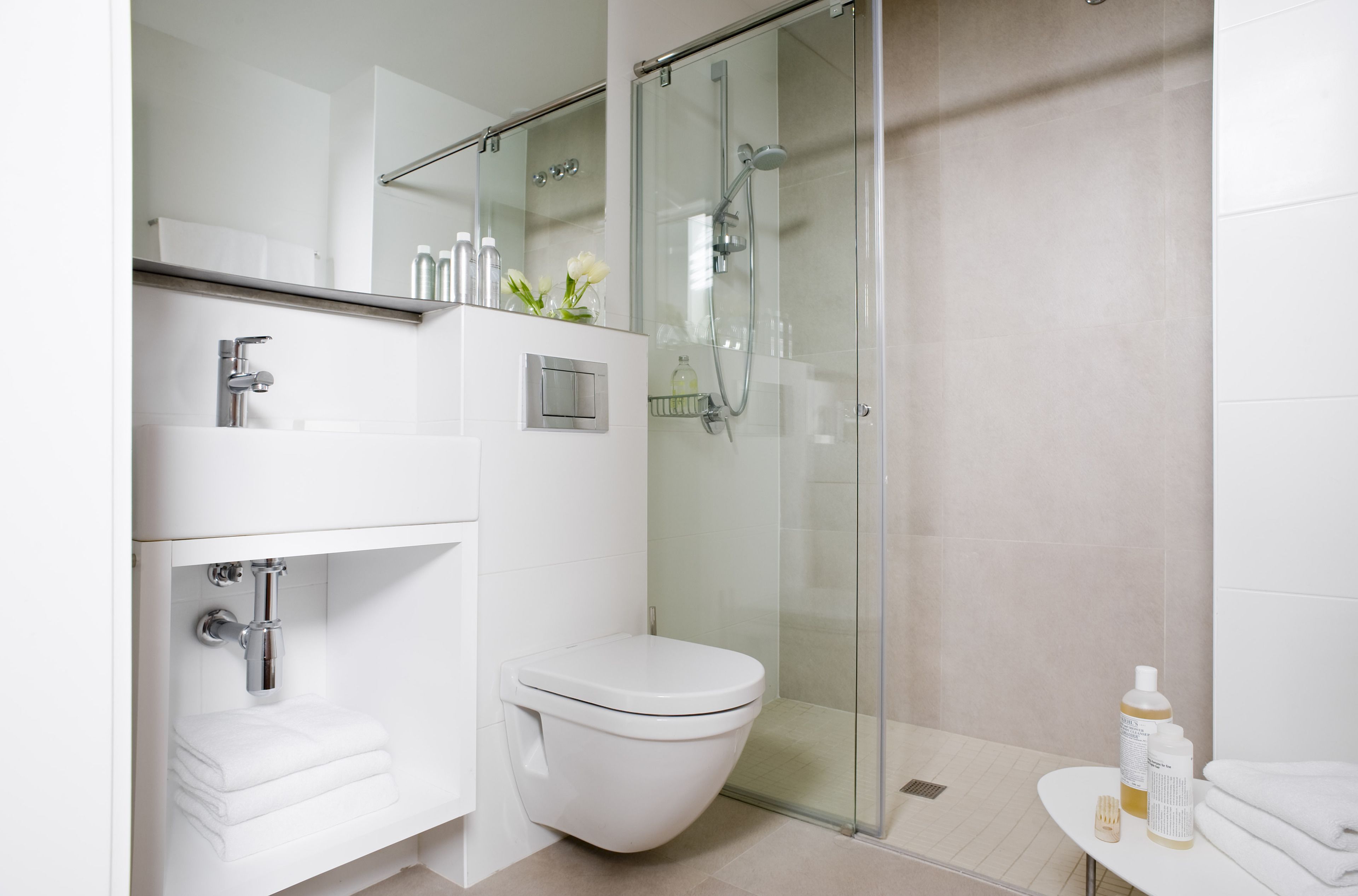 Shower, hair dryer, towels, toilet paper