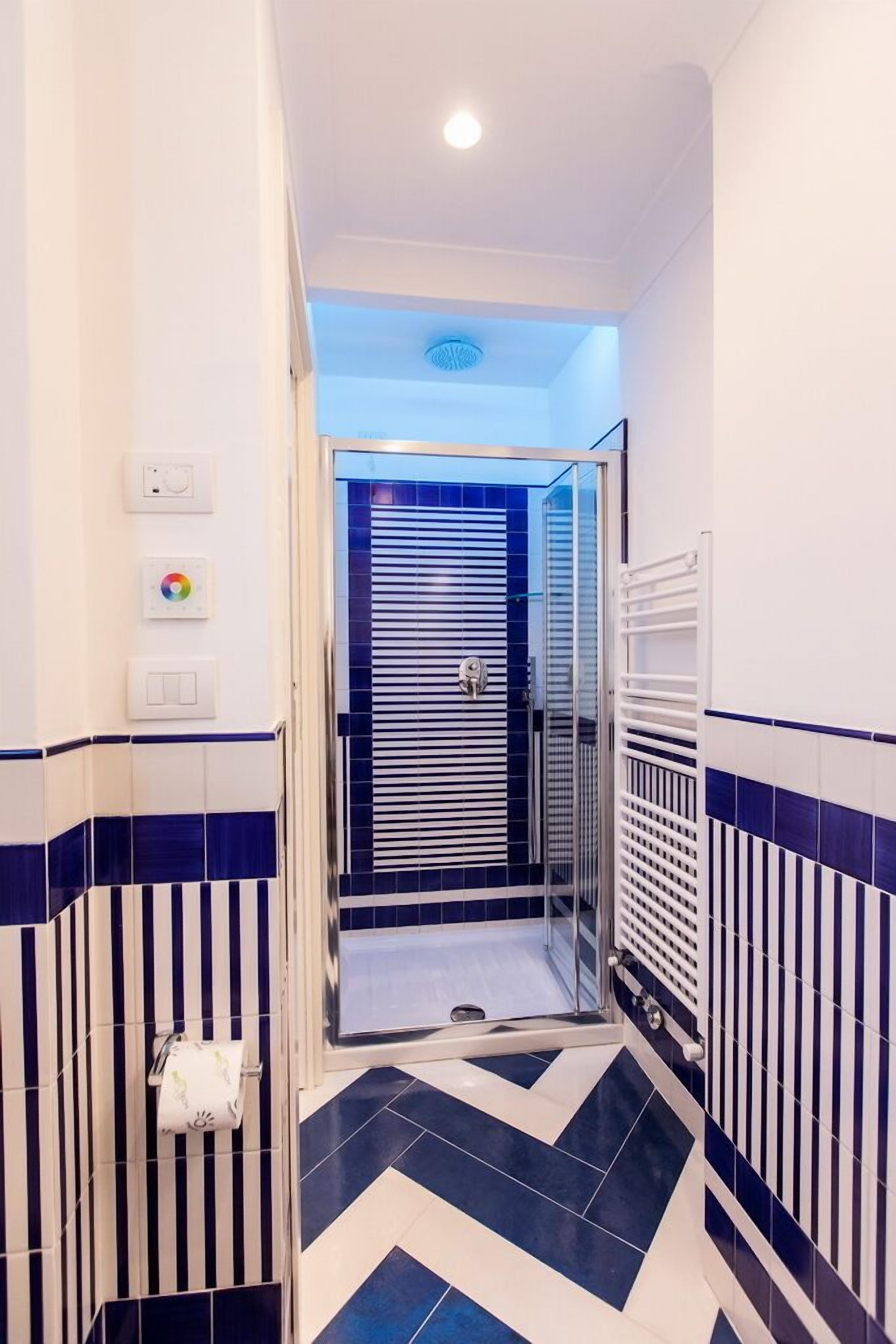 standard double room, pool view | bathroom | shower, rainfall showerhead, hair dryer, bathrobes