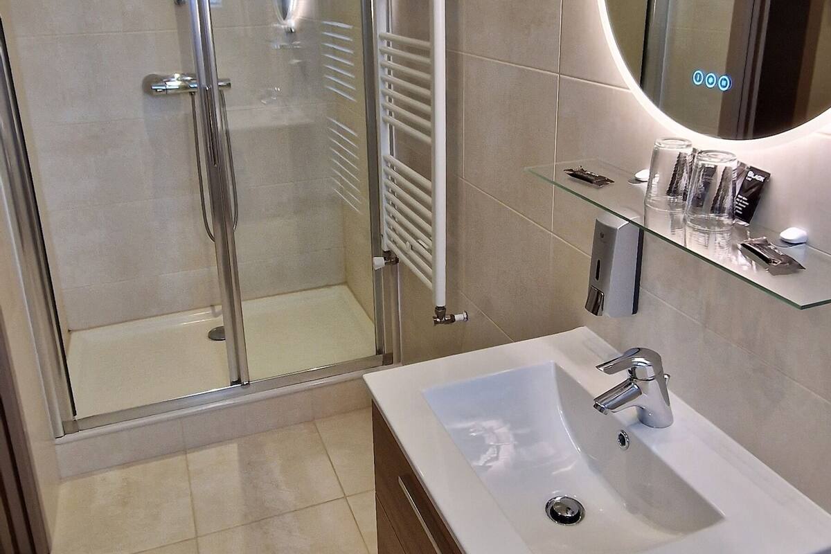 comfort double room | bathroom | shower, eco-friendly toiletries, hair dryer, dressing gowns