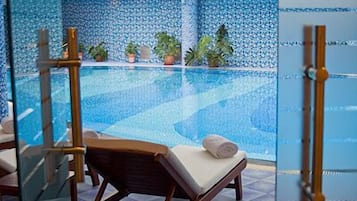 Indoor pool, open 8 AM to 10 PM, pool loungers