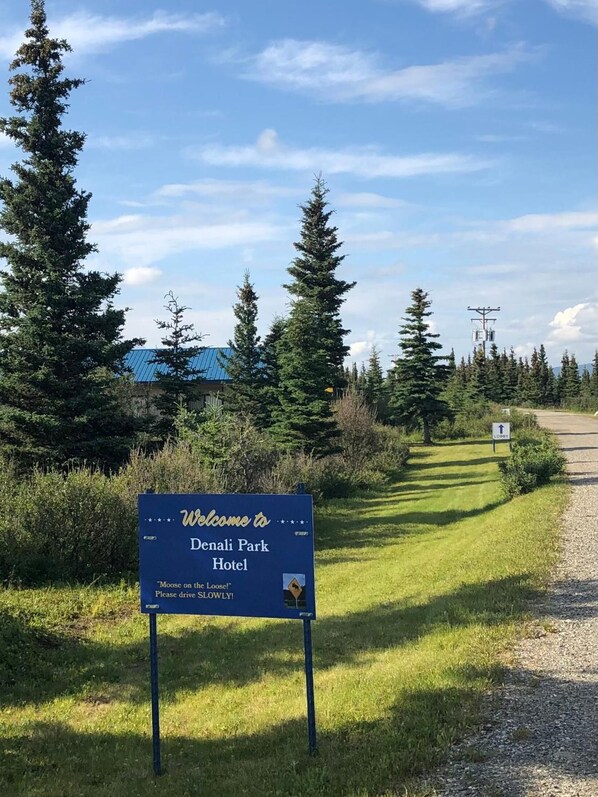 A welcome sign for Denali Park Hotel with a message about moose and driving slowly. - Denali Park Hotel (Healy)