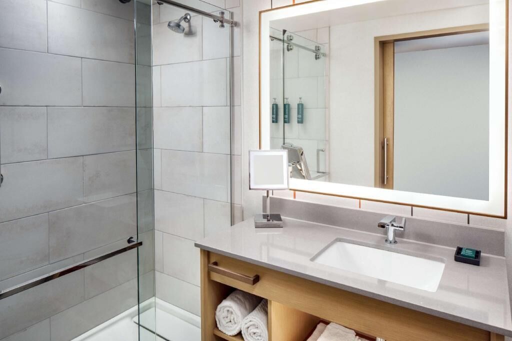 Designer toiletries, hair dryer, towels, soap