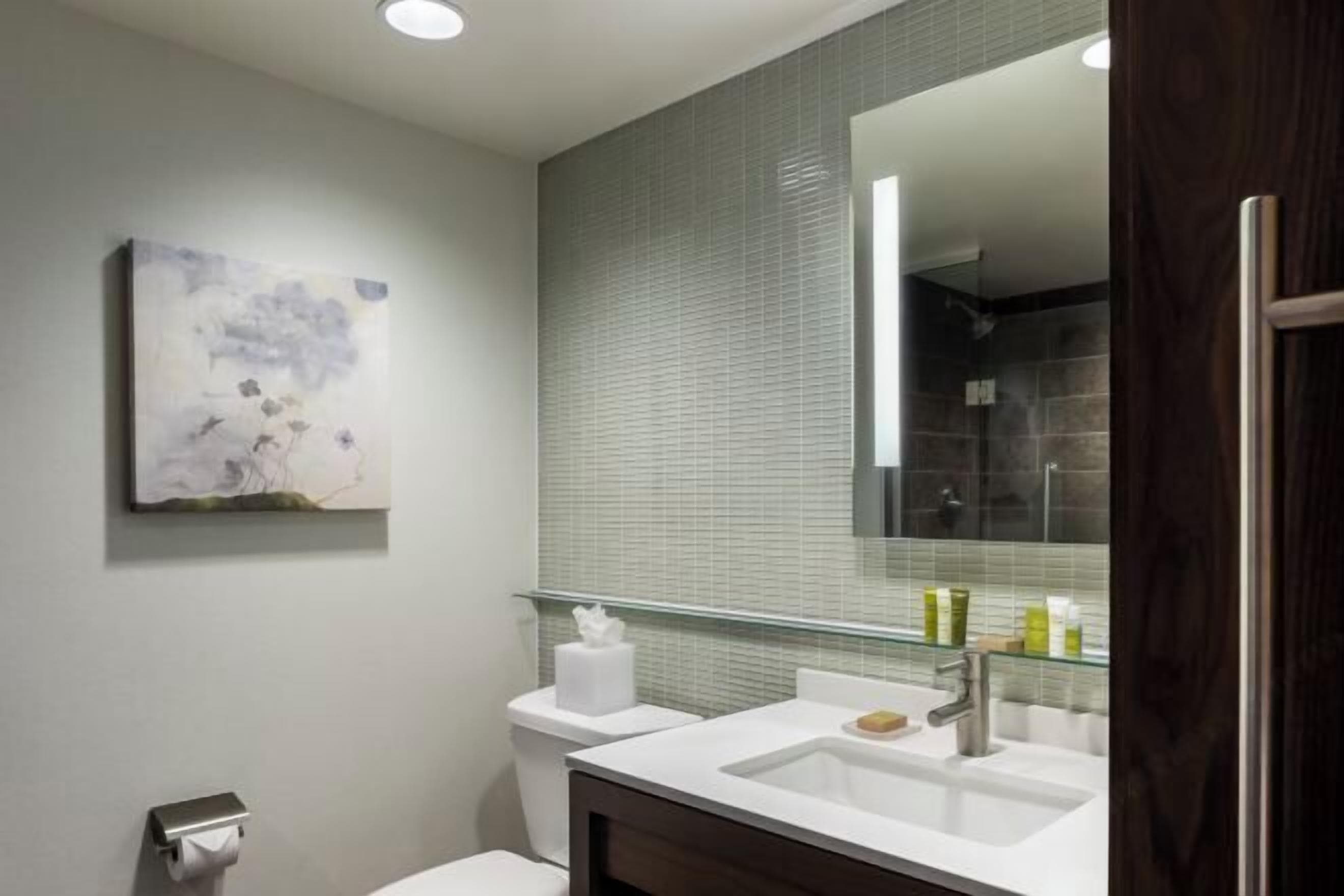 Designer toiletries, hair dryer, towels, soap