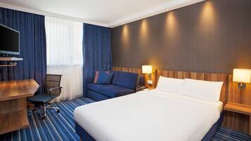 Hypo-allergenic bedding, desk, laptop workspace, blackout drapes