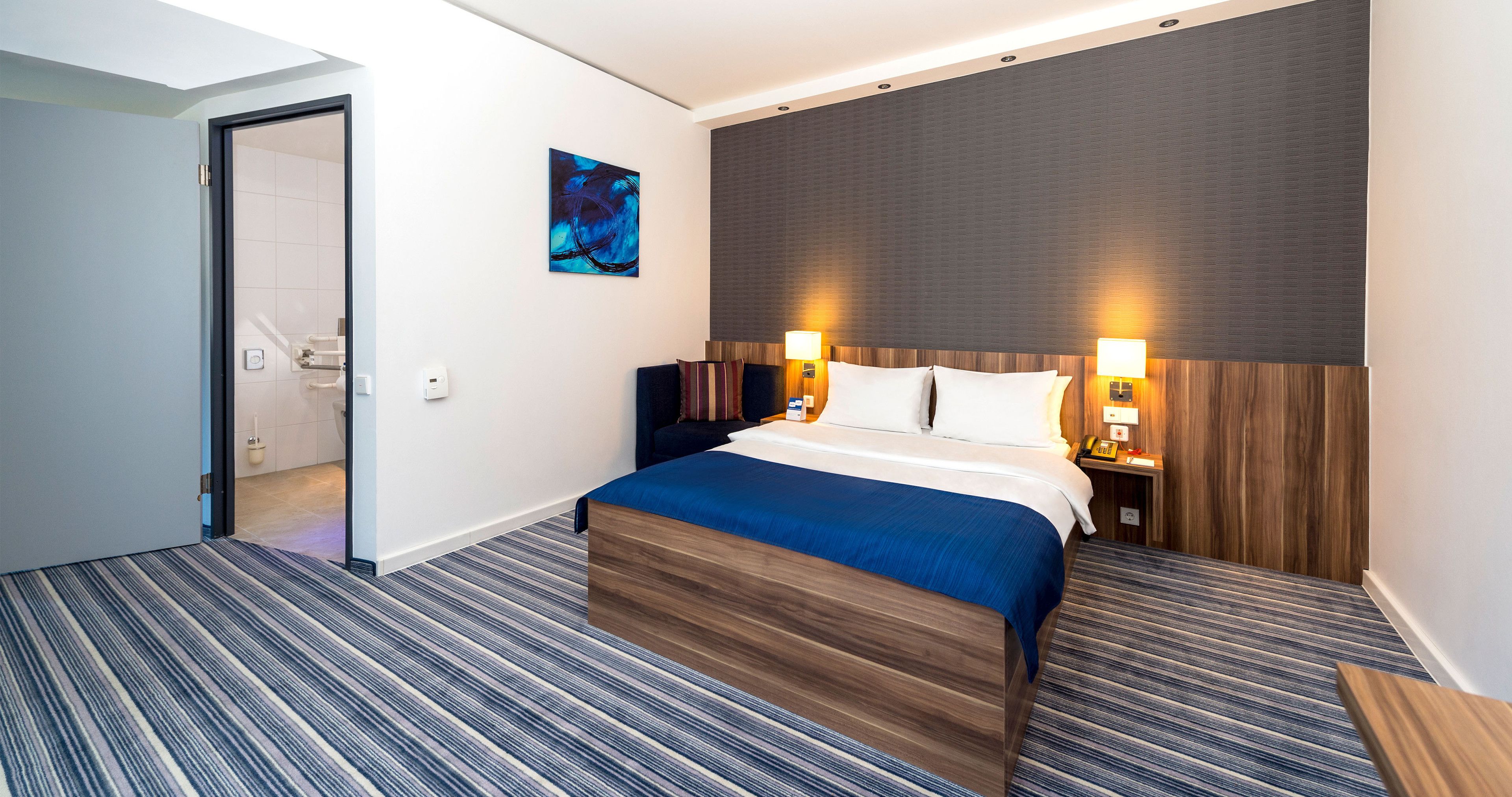 hypo-allergenic bedding, desk, laptop workspace, blackout curtains