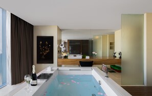 Grand Deluxe Lagoon Suite | Bathroom | Separate tub and shower, rainfall showerhead, designer toiletries