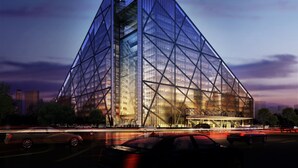 A modern building with a glass facade and a geometric design. - Hotel Eclat Beijing (Beijing)