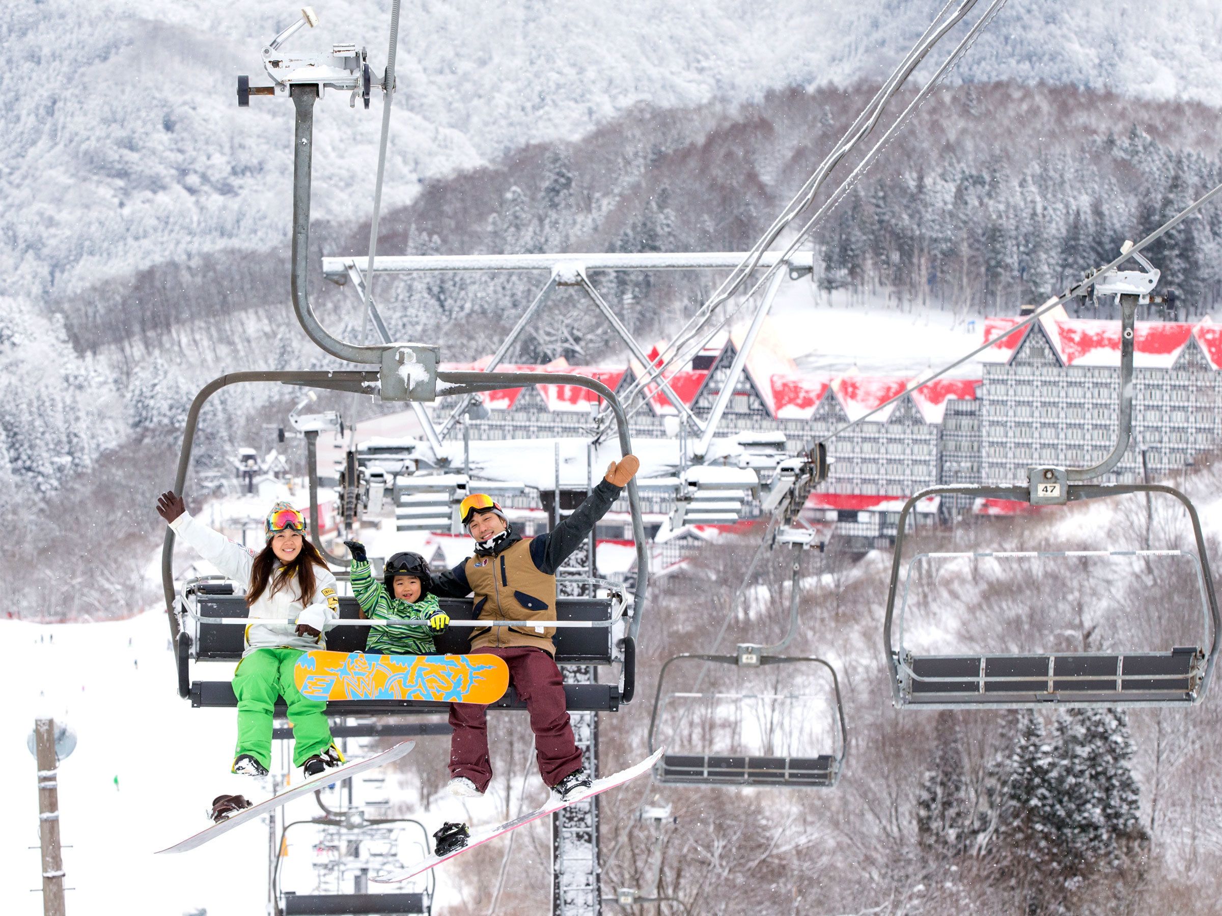 A ski lift with passengers.