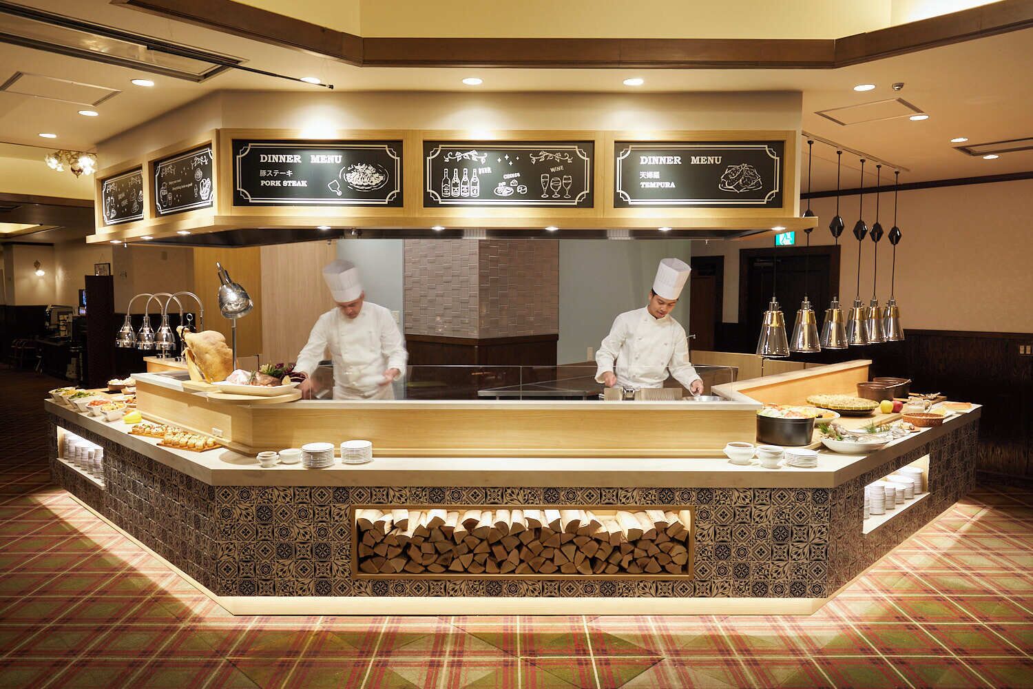 A buffet setup with a central serving area and multiple food stations.