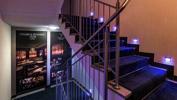 A staircase with metal railings leading to a lower level.