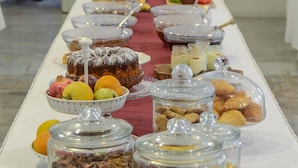 A buffet table with various food items and condiments. - Aeolis Boutique Hotel (Naxos)