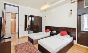 Deluxe Room | Down comforters, individually decorated, individually furnished, desk