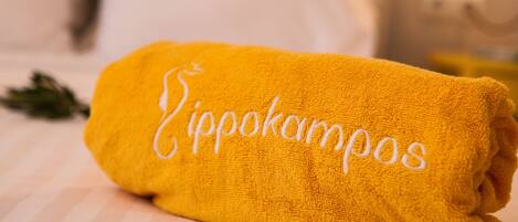 A yellow towel with the word "Zippokampos" embroidered on it.