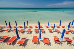 Private beach, white sand, sun loungers, beach umbrellas