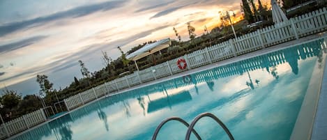 Outdoor pool, pool umbrellas, sun loungers