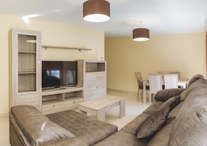 Apartment, 3 Bedrooms | Living room | Flat-screen TV