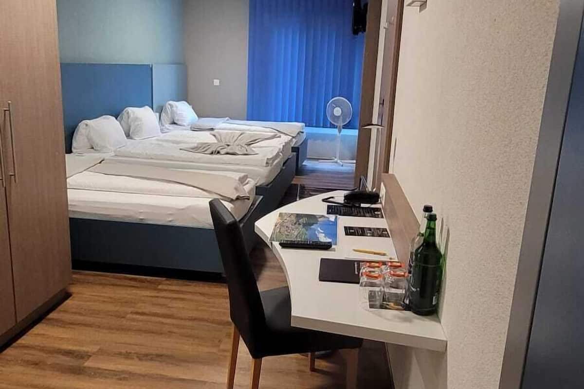 economy quadruple room | 1 bedroom, premium bedding, select comfort beds, in-room safe