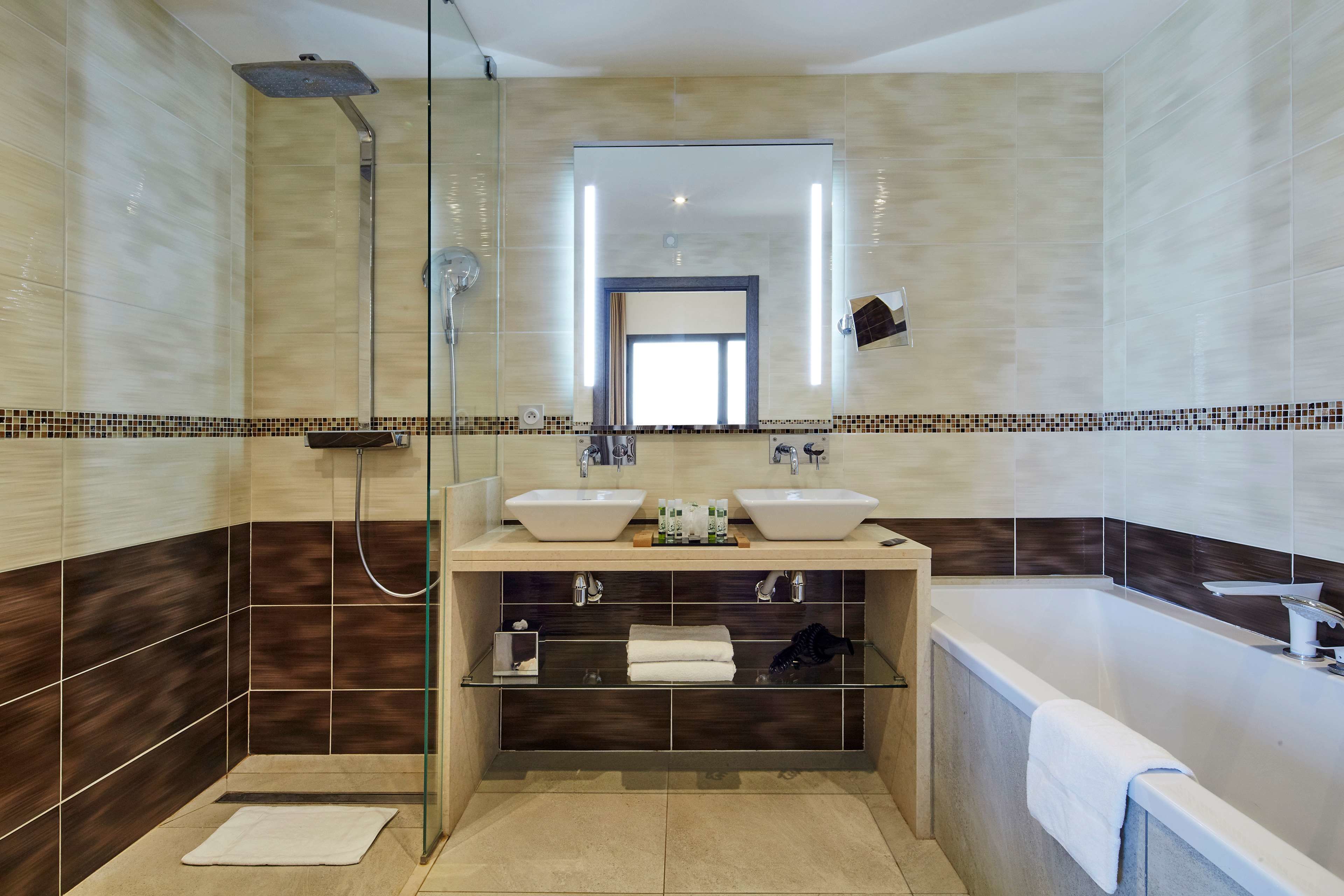 suite with spa access | bathroom | eco-friendly toiletries, hair dryer, towels