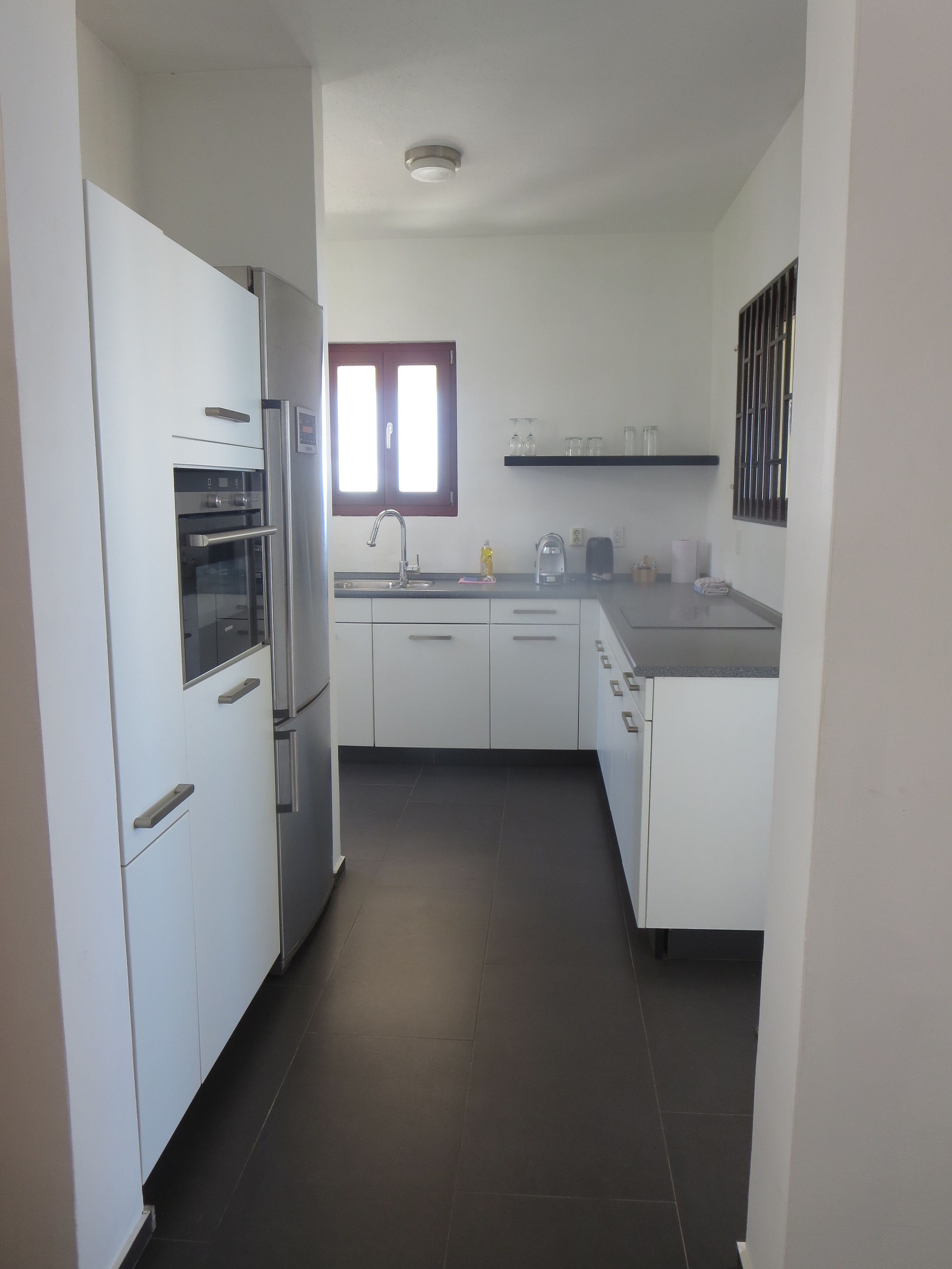 apartment, 2 bedrooms, ocean view | private kitchen | fridge, coffee/tea maker, electric kettle