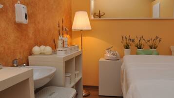 Enjoy a comfortable stay in this well-appointed room with a modern bathroom and a cozy bed area.