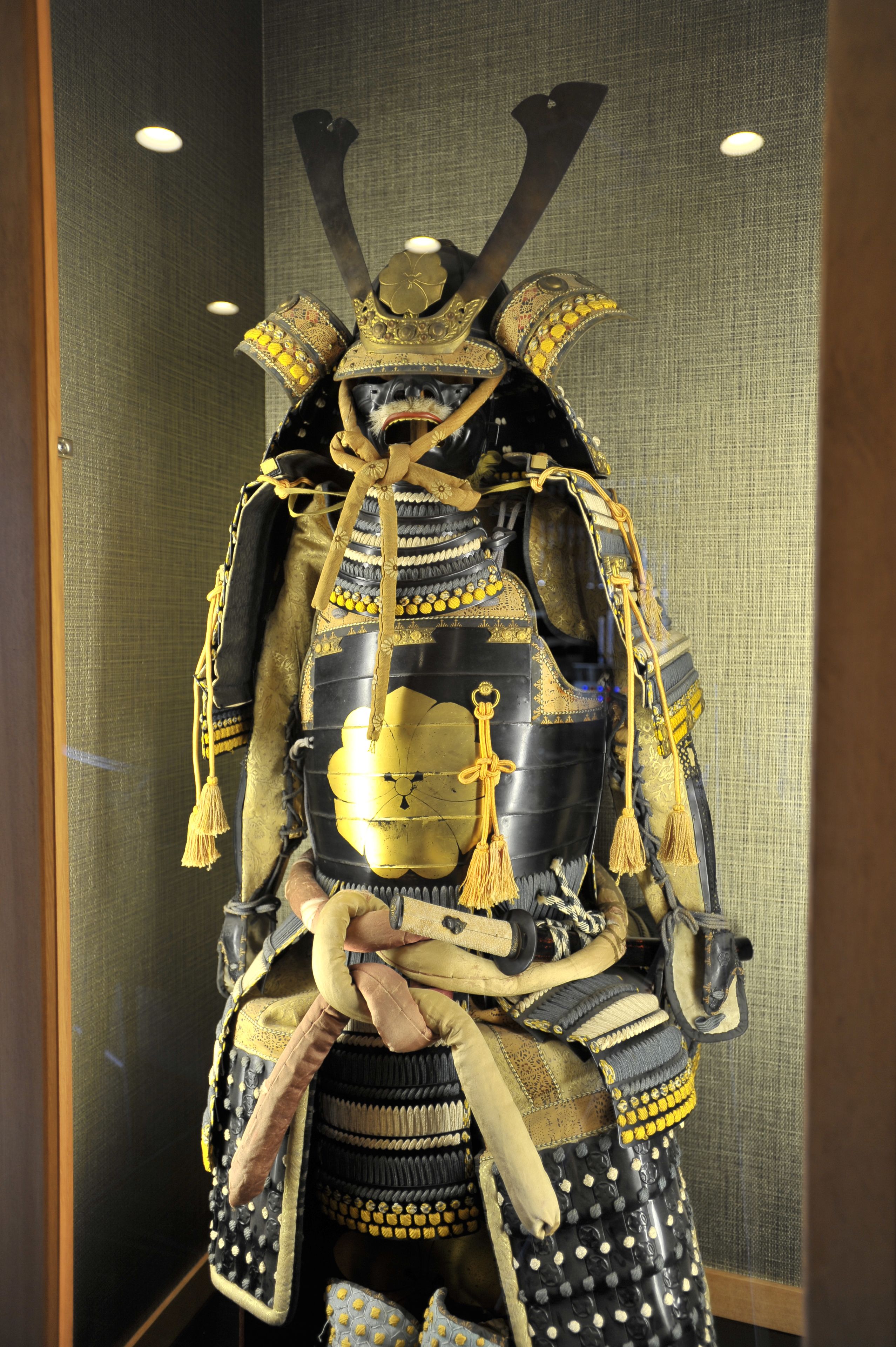 A display of a samurai armor with intricate designs and decorations.