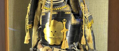 A display of a samurai armor with intricate designs and decorations.
