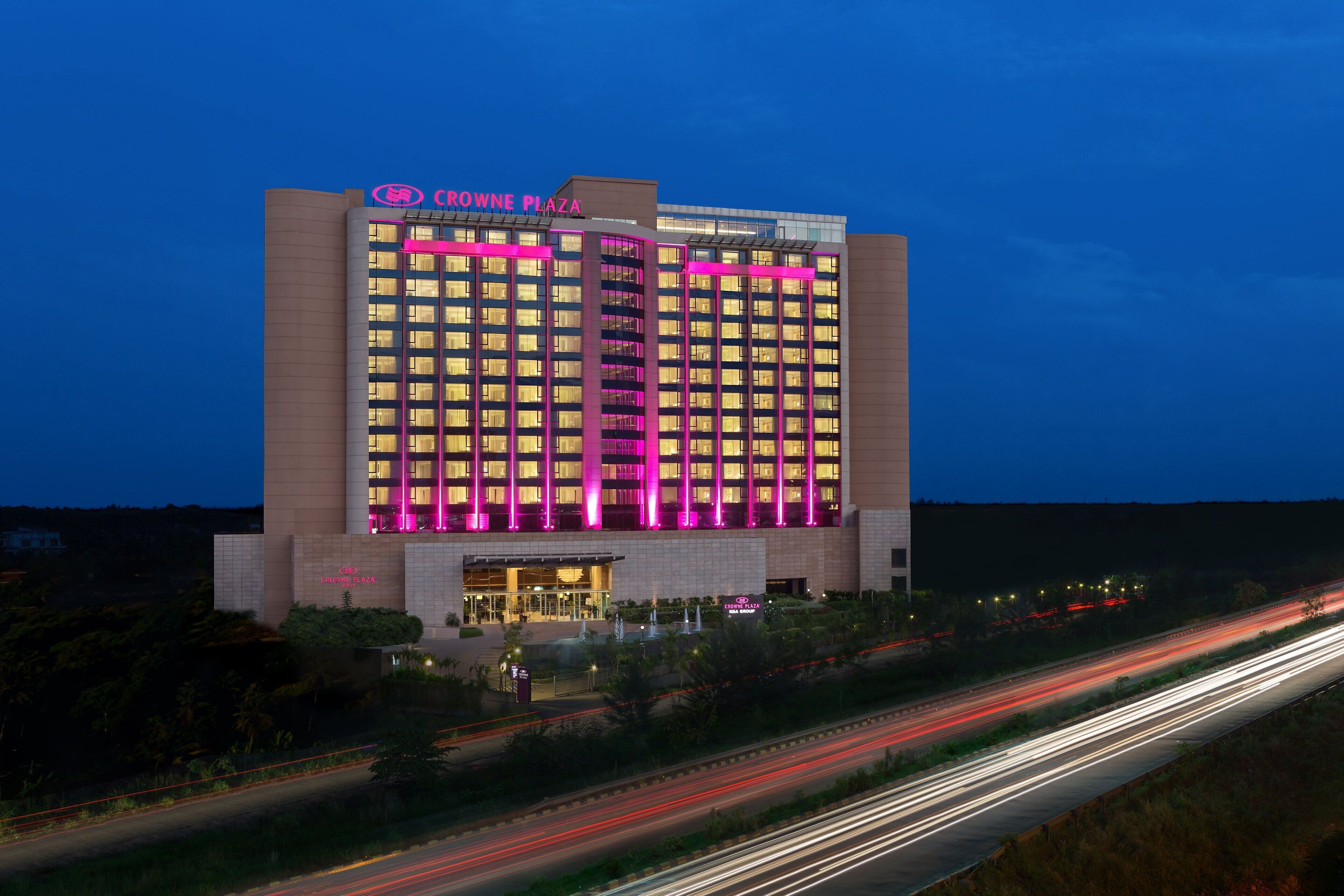 A multi-story hotel with a prominent signage at the top.