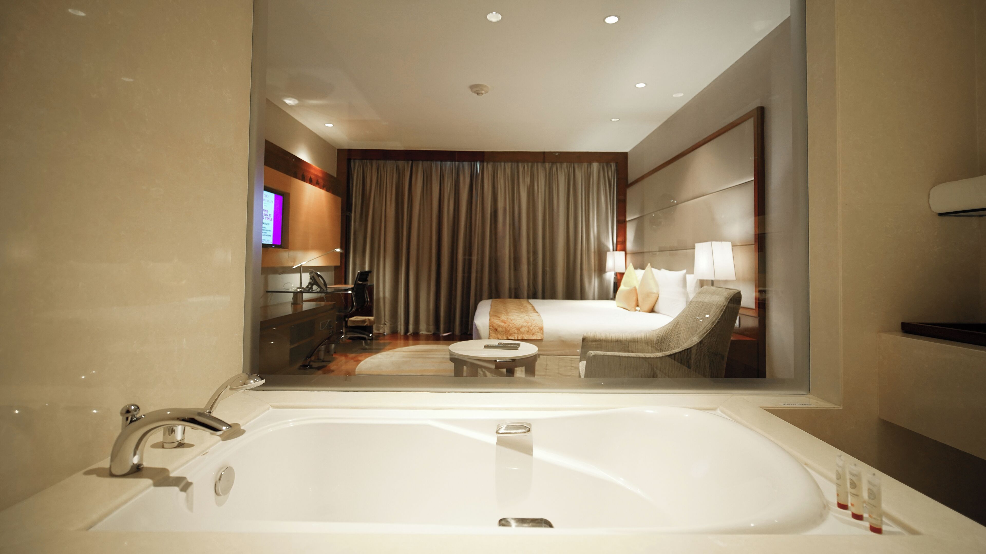 premium room, 1 king bed | bathroom | combined shower/bathtub, deep-soaking bathtub, rainfall showerhead