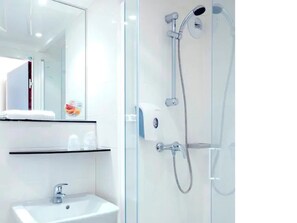 Shower, eco-friendly toiletries, towels, soap