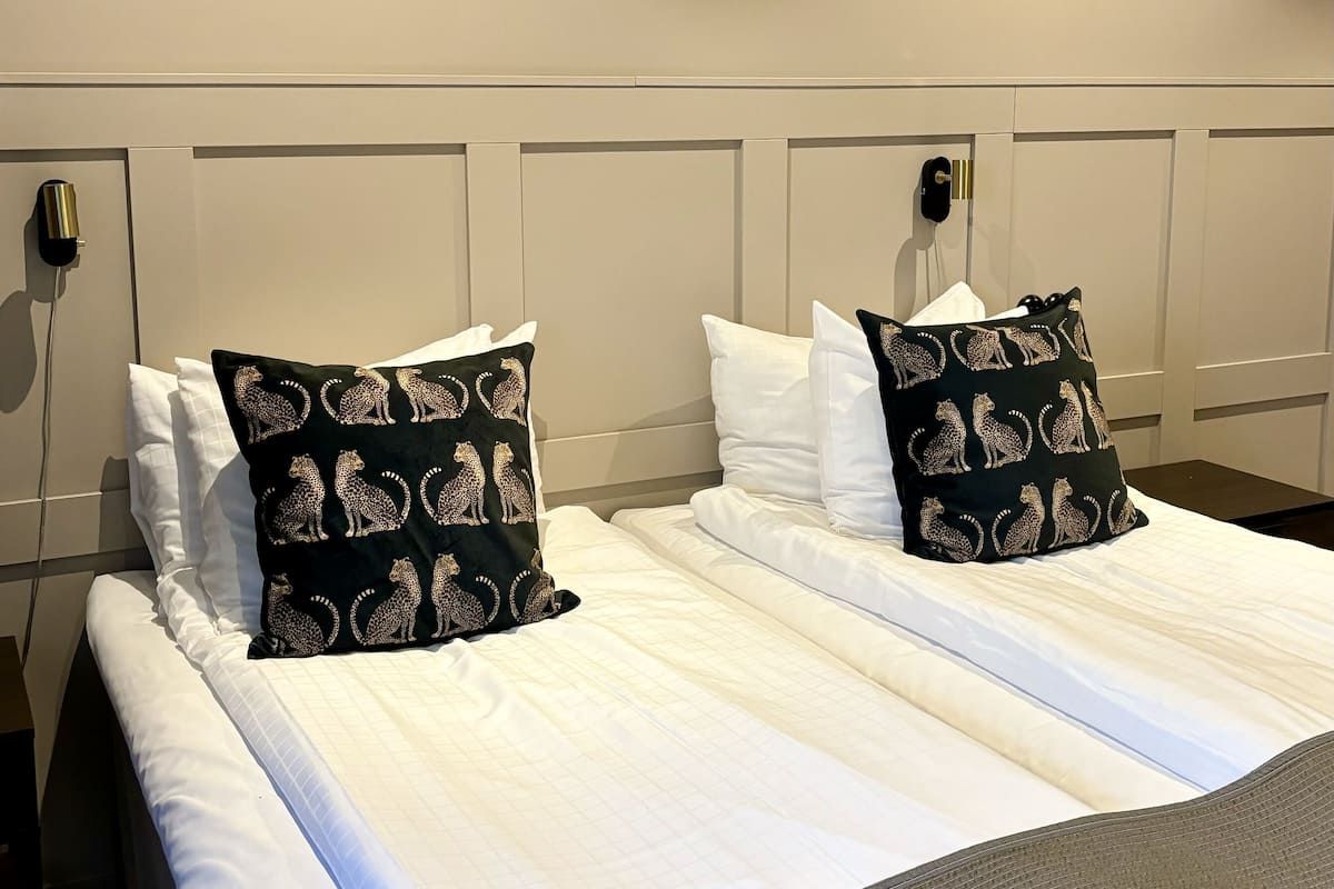 family room with three beds | 1 bedroom, premium bedding, pillow-top beds, individually decorated