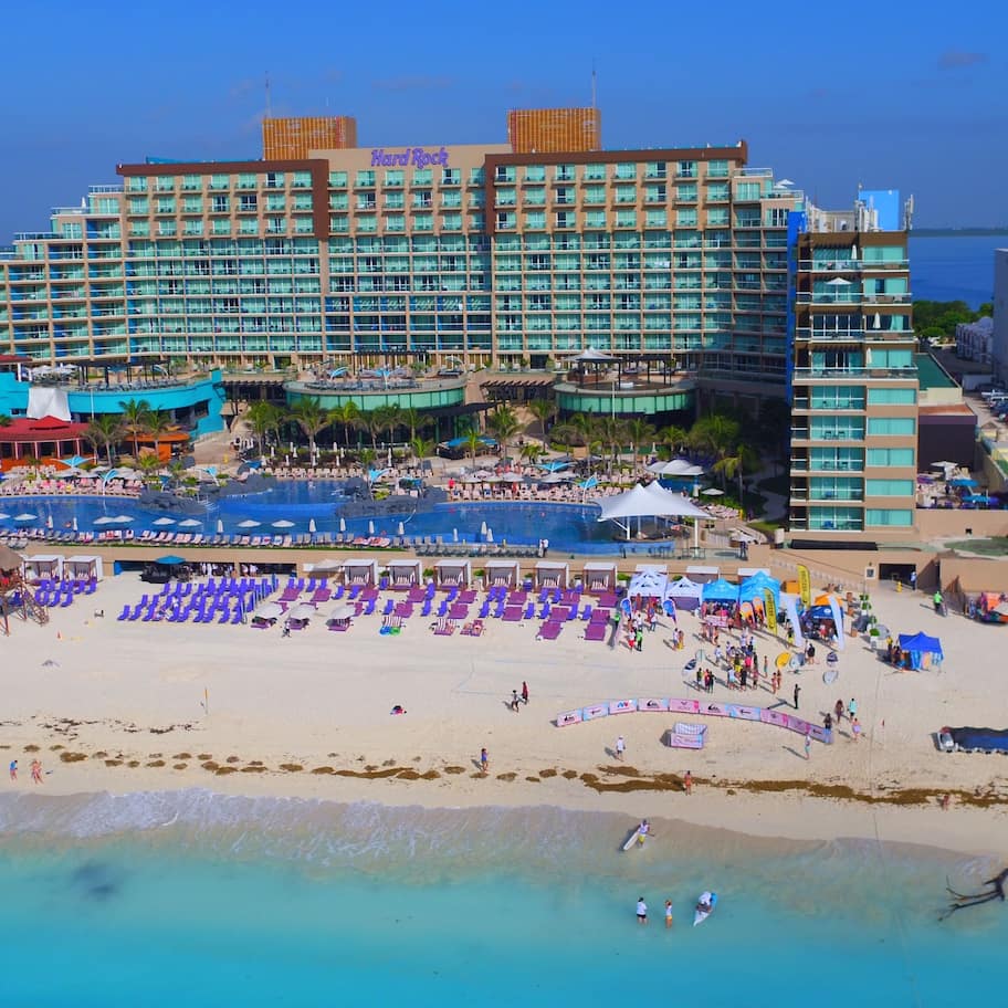 On the beach, white sand, sun loungers, beach umbrellas