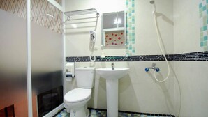 A bathroom with a toilet, sink, and shower. - Happiness Inn (Taipei)