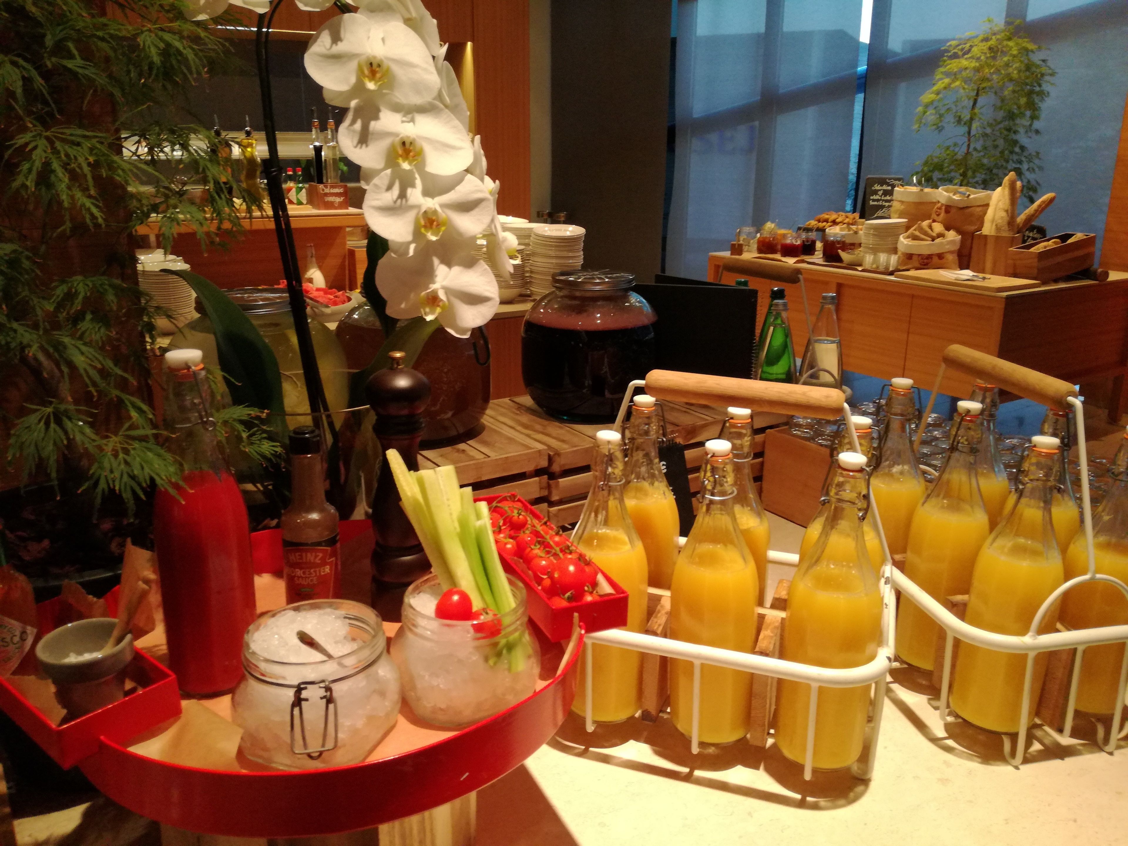 A breakfast buffet with various food items and beverages.