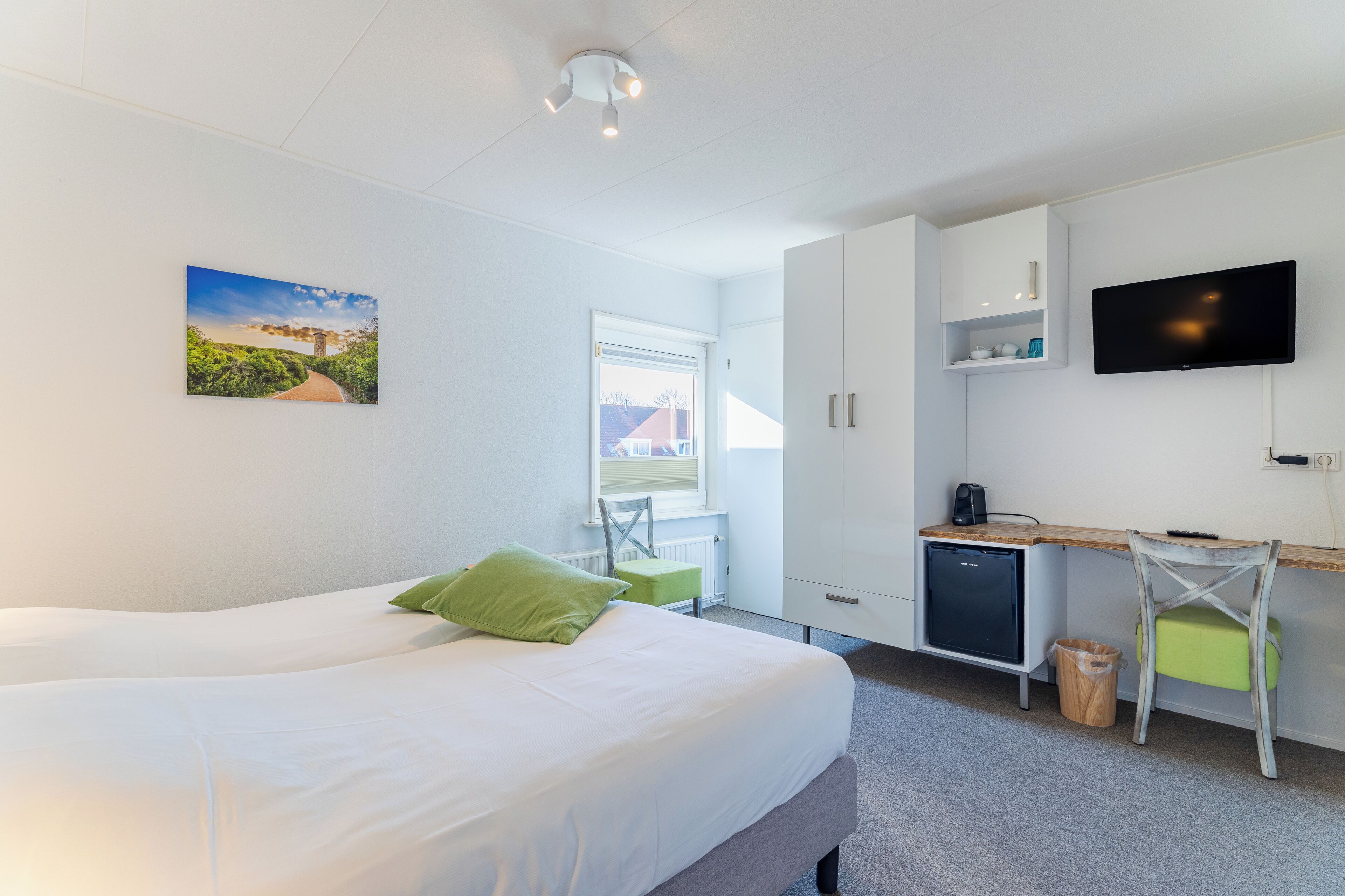 Standard Double Room | Minibar, in-room safe, blackout drapes, iron/ironing board