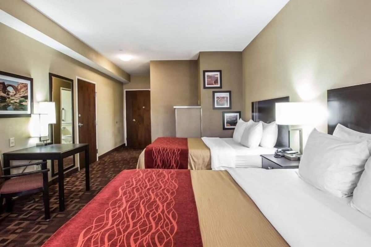 Desk, iron/ironing board, bed sheets, alarm clocks