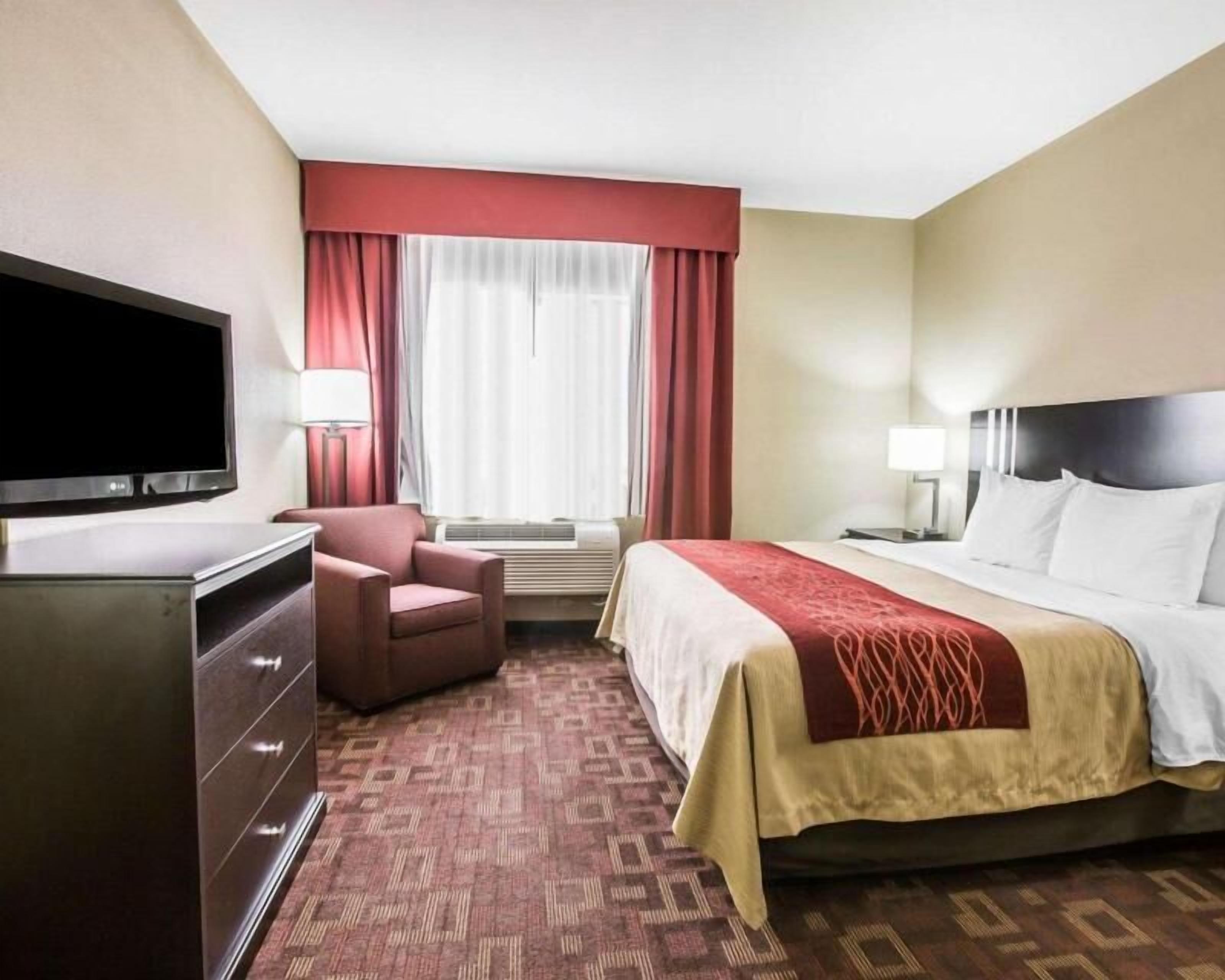 Desk, iron/ironing board, bed sheets, alarm clocks